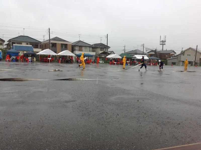 豪雨の中の大会の写真 6